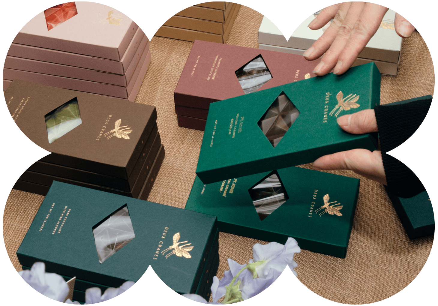 Hands packaging Deux Cranes handcrafted chocolate bars