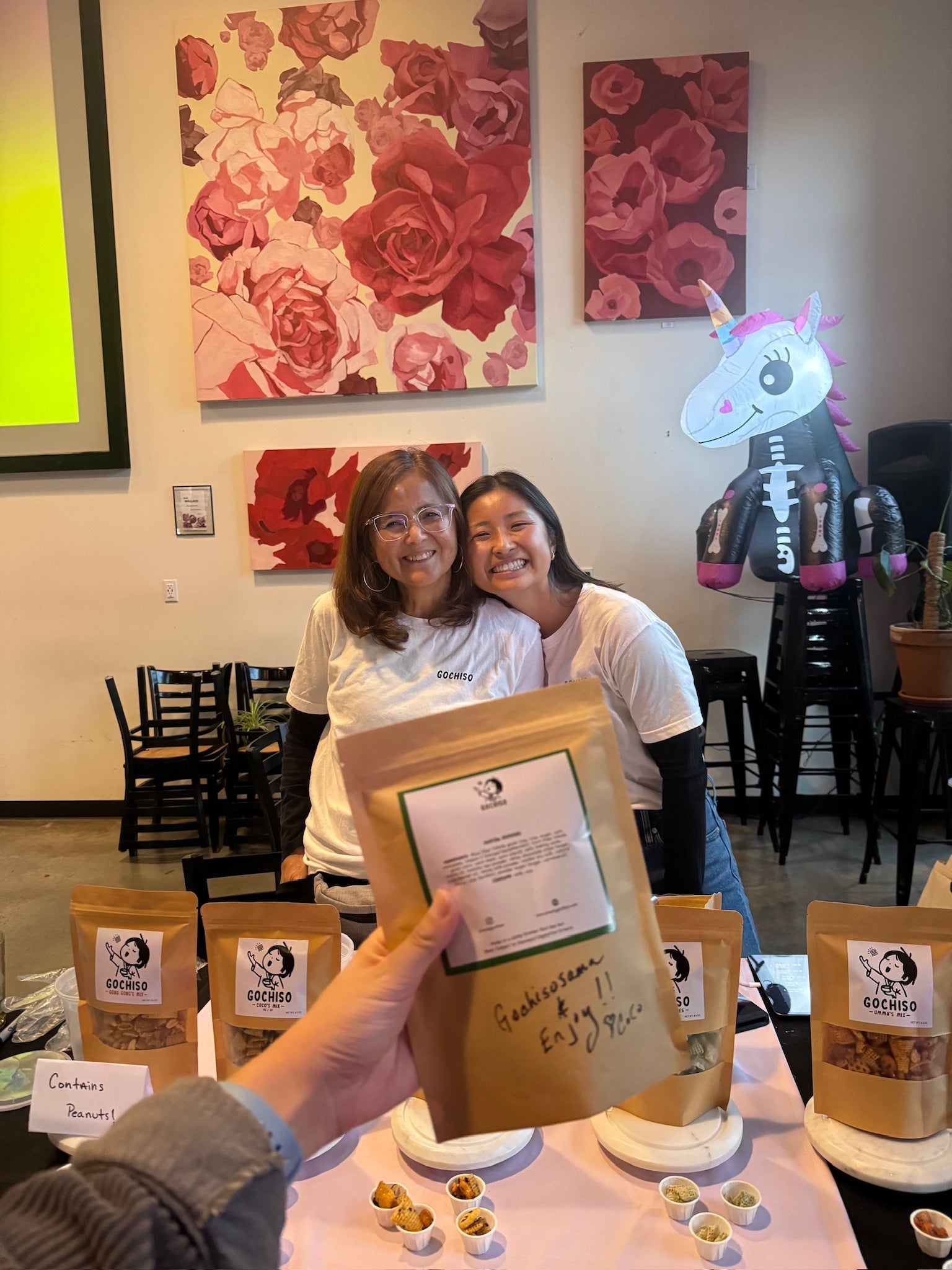 Gochiso founder Kira and her mother Coco sharing snack mix