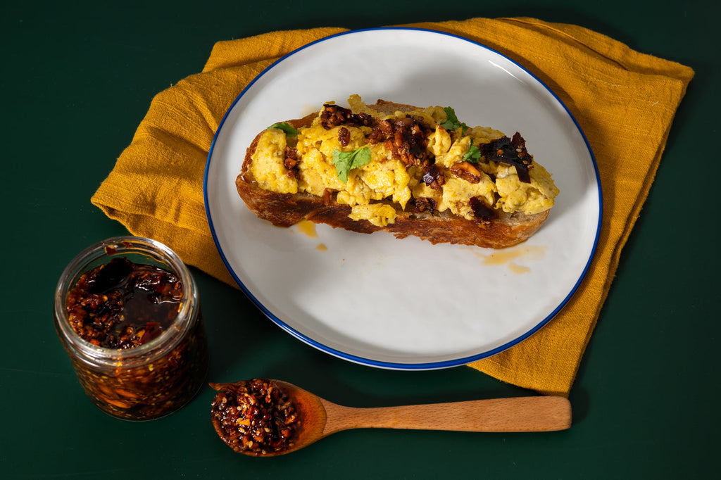 Mucha Macha Original salsa macha served with scrambled eggs on toast