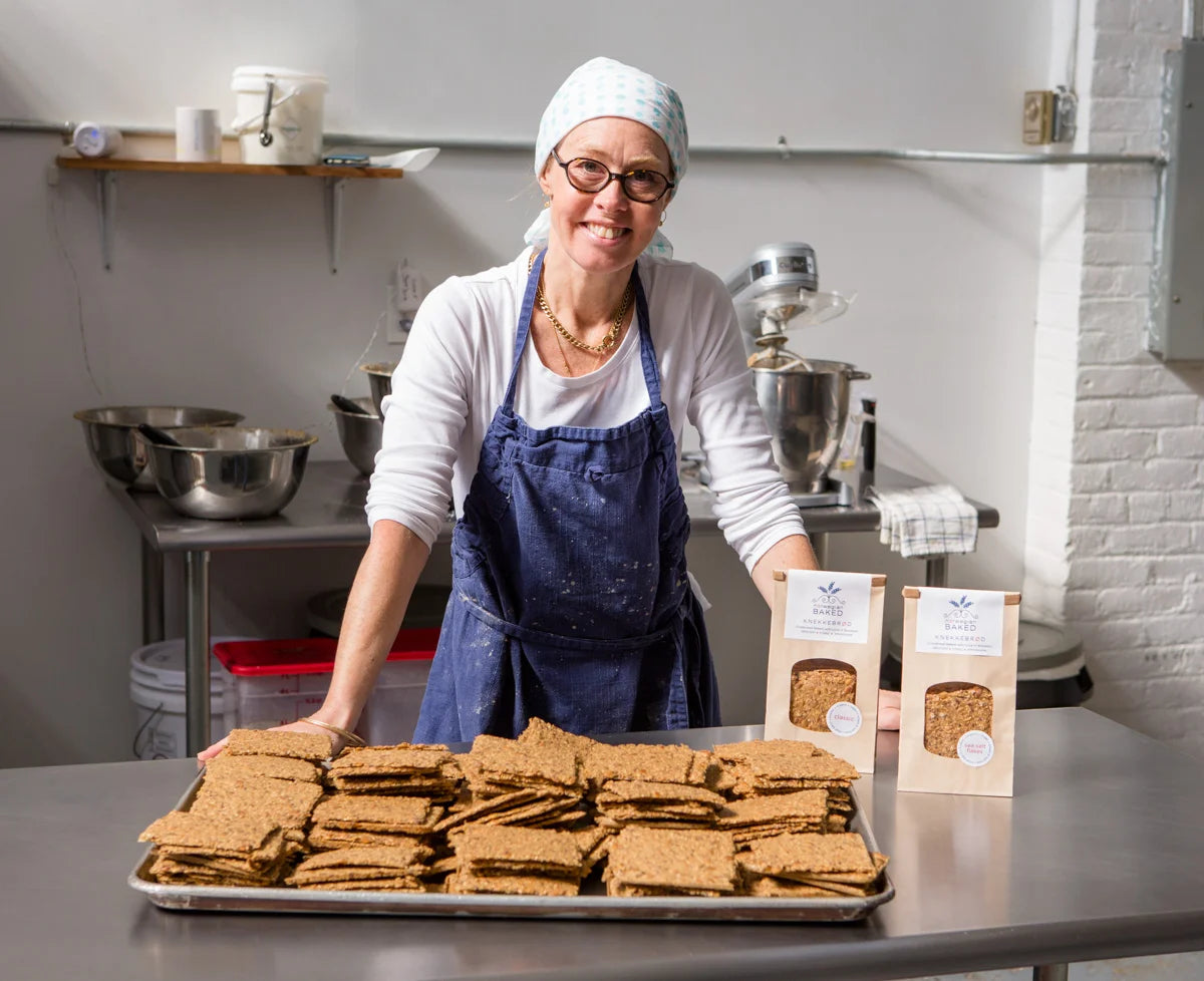 Norwegian Baked founder Hedvig with fresh crispbread in the bakery